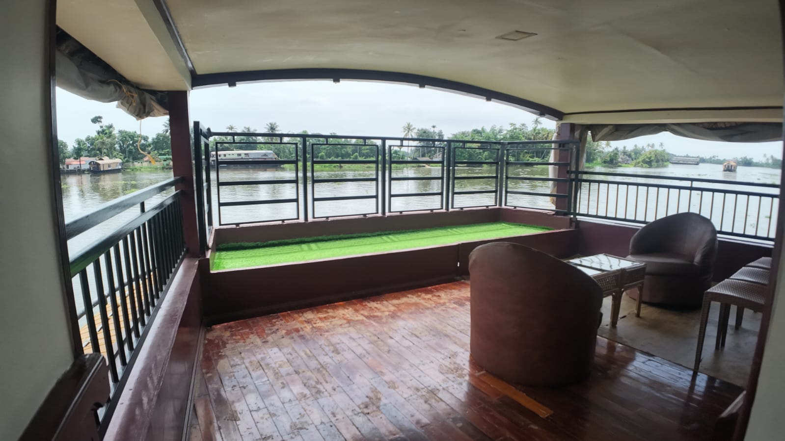Open deck of an Alleppey houseboat looking out over the Kerala backwaters
